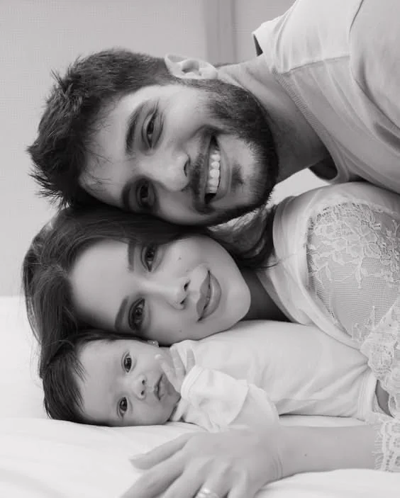 Parents resting with their baby